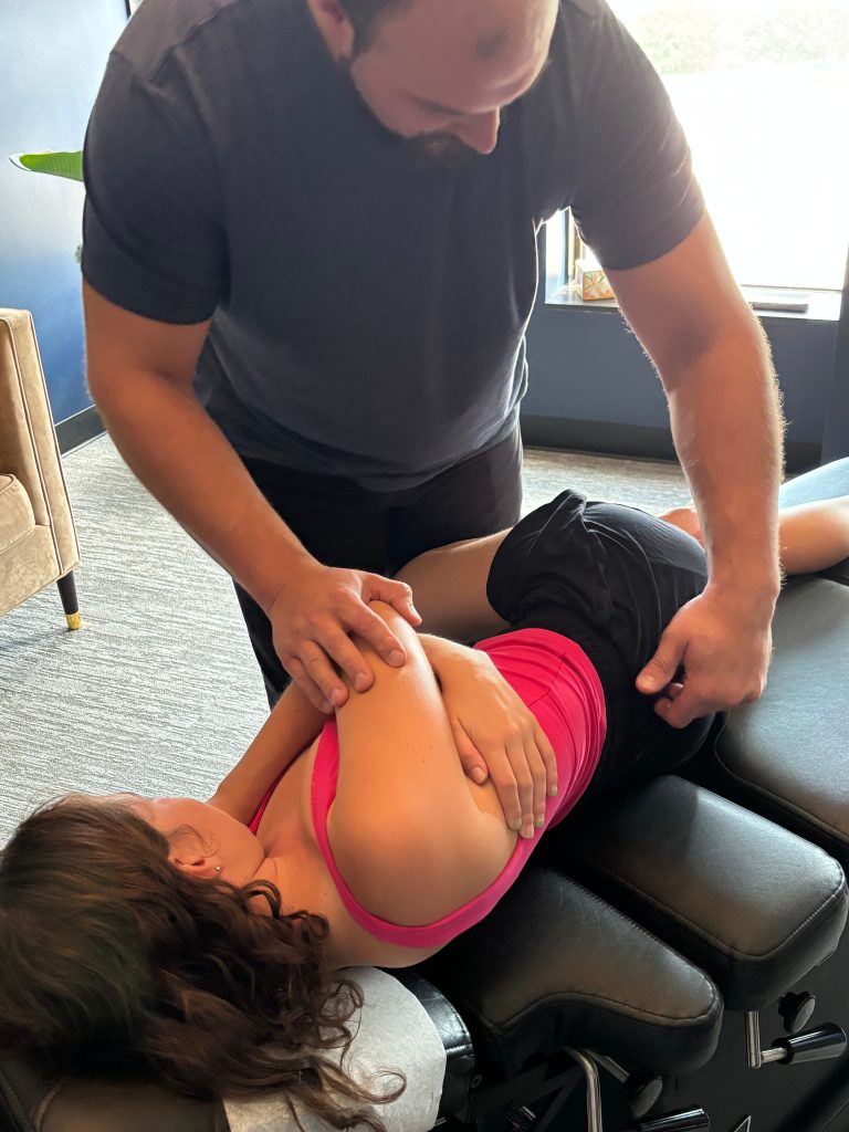 patient recieving chiropractic care for low back pain at aspire health clinic in dallas